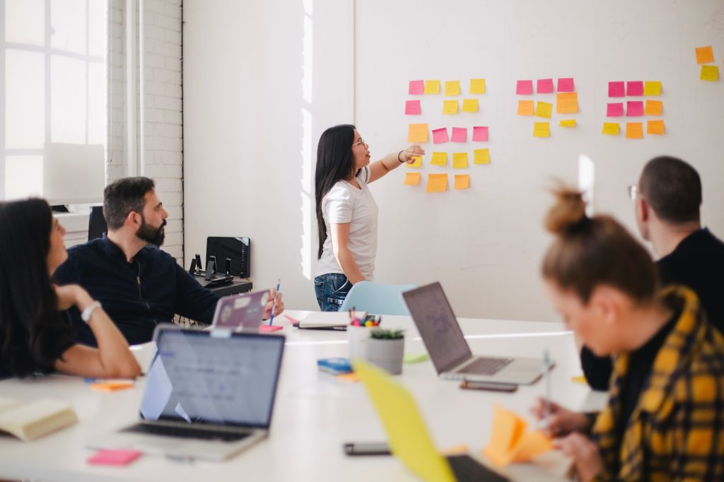 IT consultants advising a business team in a meeting
